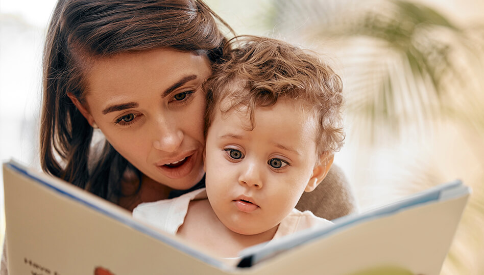 Caregiver reading book to child